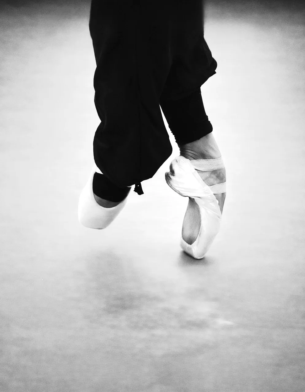 Feet rising onto pointe in pointe shoes at the ARTIS studio, Vienna
